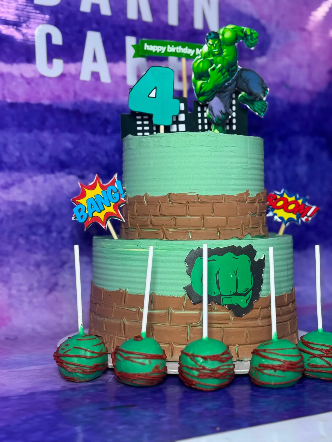 Multi-tier themed birthday cake with matching cake bites